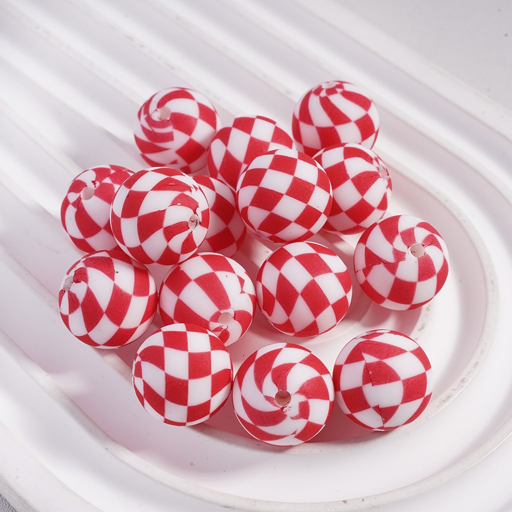 Red and white checkered candies on a white plate