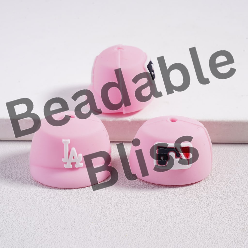 Pink beaded products with 'Beadable Bliss' text on a light background