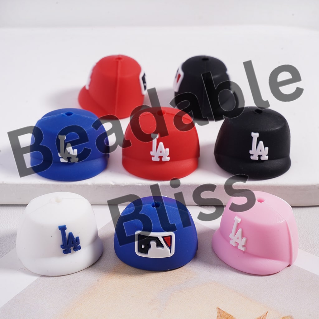 Colorful silicone Los Angeles Dodgers caps on a white background with 'Beadable Bliss' branding.