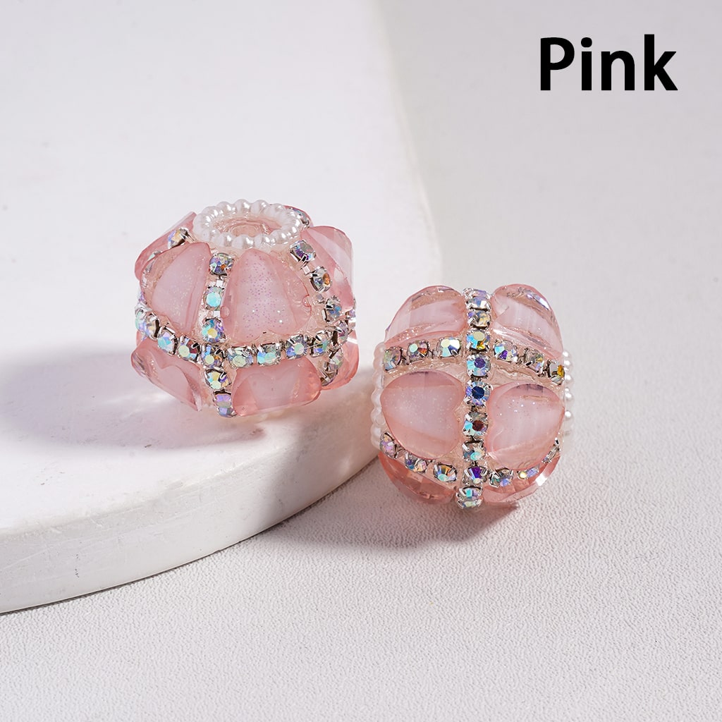 Pink earrings with gemstones on a white background