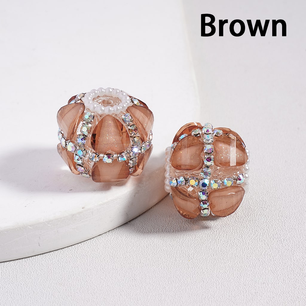 Brown beaded earrings with gemstone accents on a white background