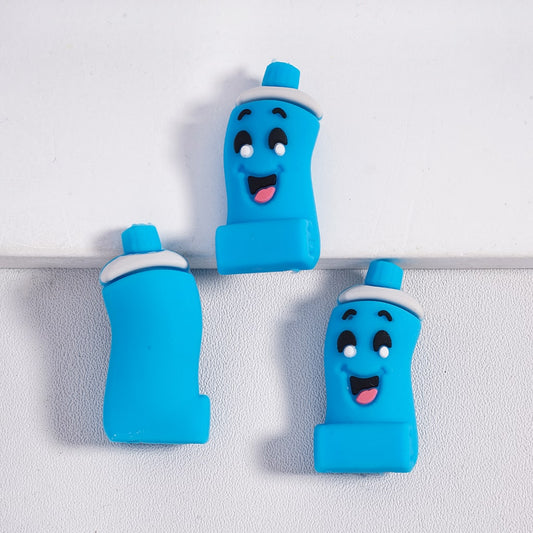 Three blue cartoon-style bottles with smiling faces on a light gray background