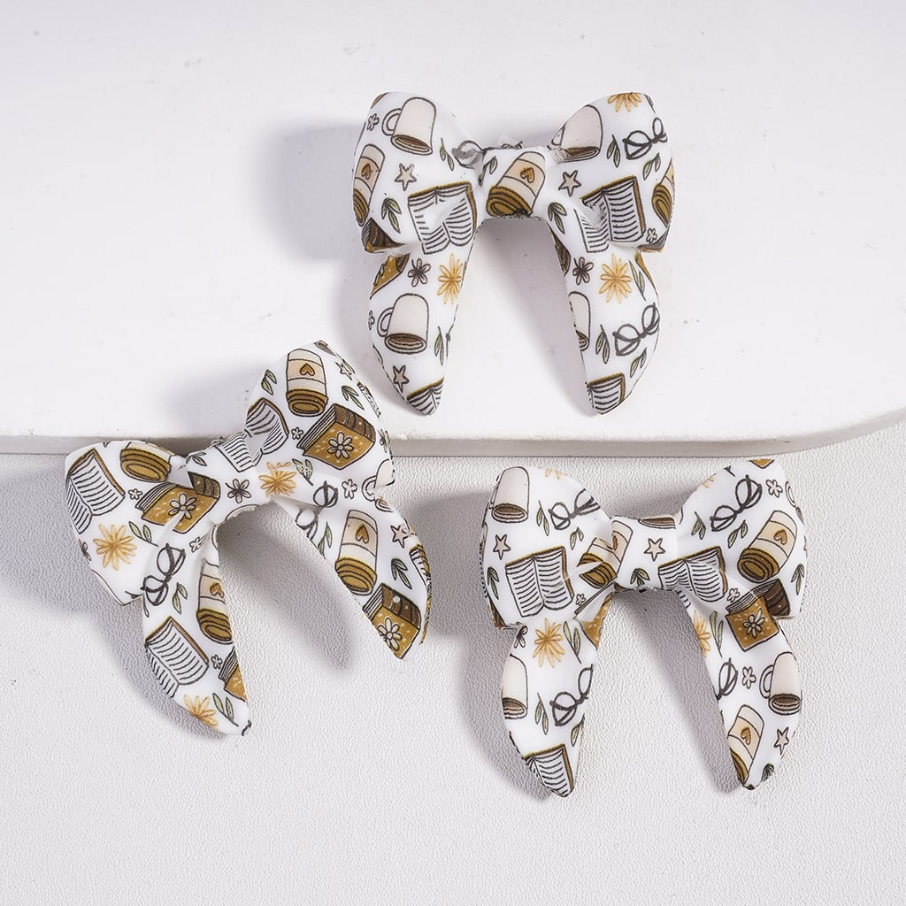 Three decorative bows with a pattern on a white background