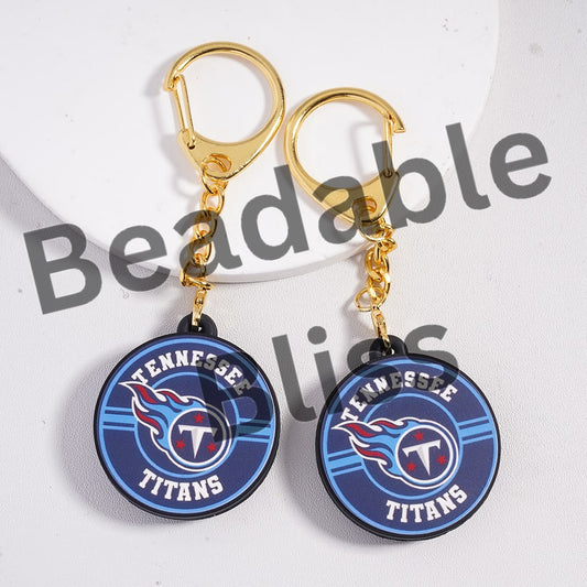 Tennessee Titans earrings with blue and gold design on a white background