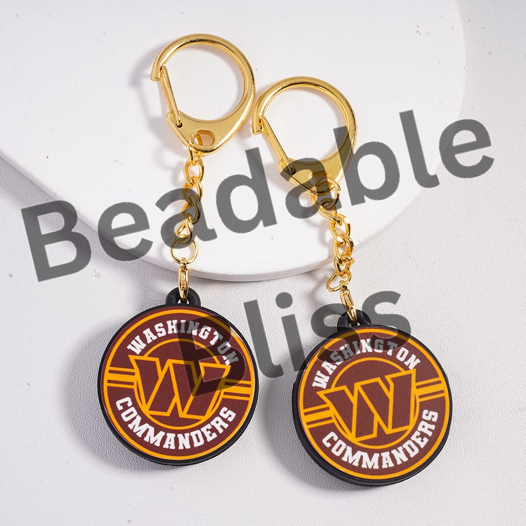 Two keychains with 'Washington Commanders' logo on a white background