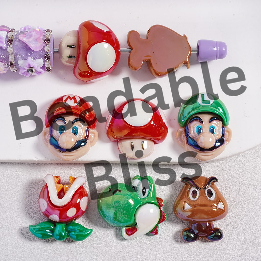 Set of colorful character beads on a white background with 'beadablebliss' branding.
