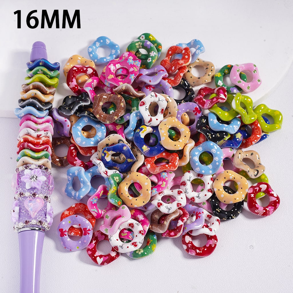 Assorted colorful donut-shaped beads with a purple tool on a white background, labeled '16MM'.