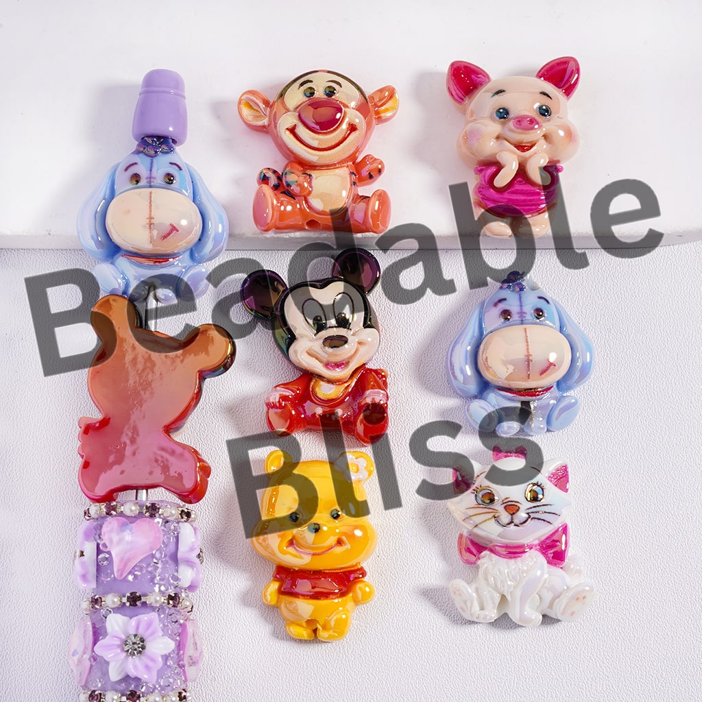 Set of colorful cartoon character hair clips on a white background