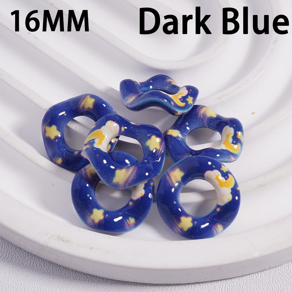 Dark blue circular objects with star patterns on a white plate
