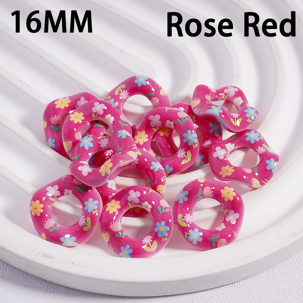 Pink floral rings on a white plate with '16MM Rose Red' text.