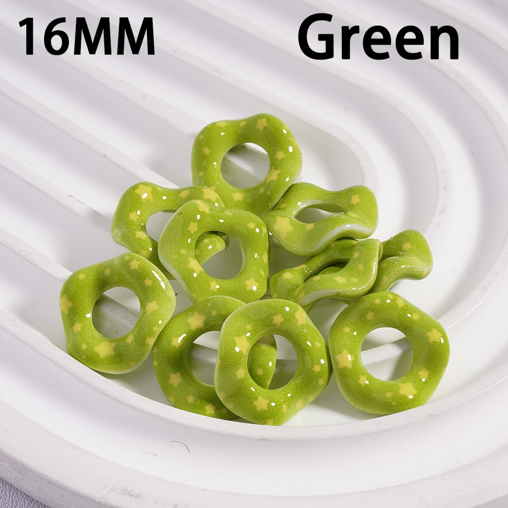 Green spiral candies on a white plate with '16MM' and 'Green' text above.