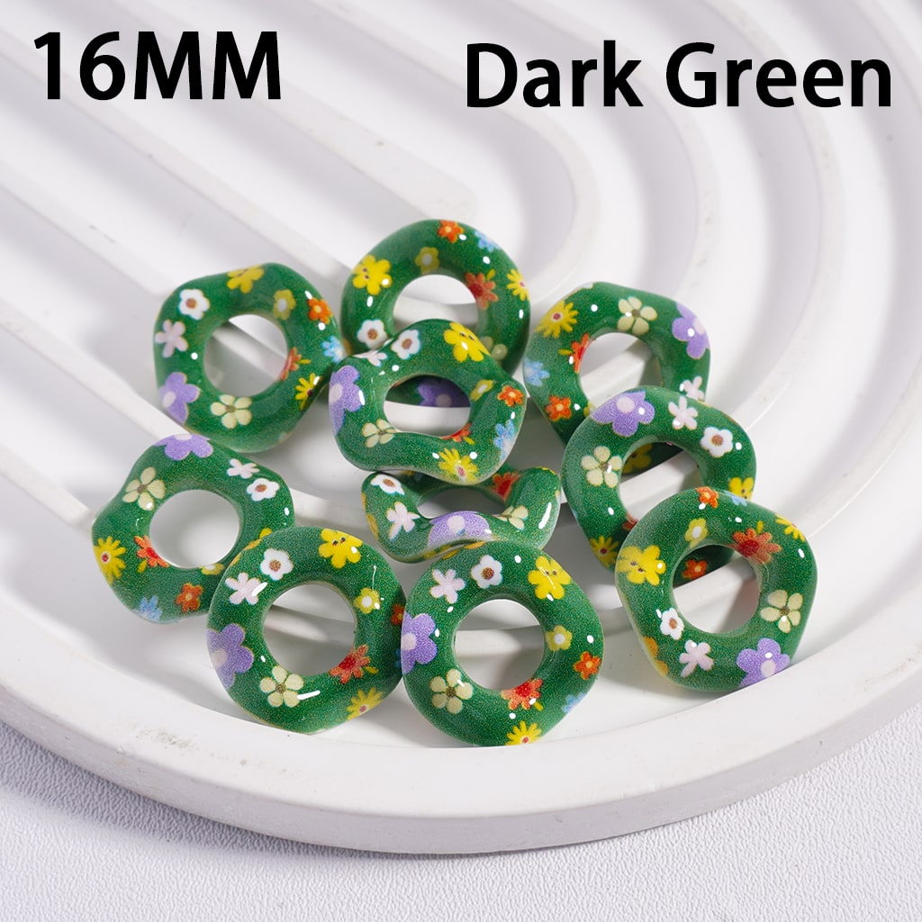 Dark green floral patterned beads on a white plate with '16MM' and 'Dark Green' text.
