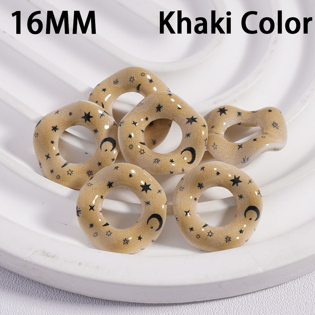 Khaki-colored circular objects with star and moon patterns on a white plate.