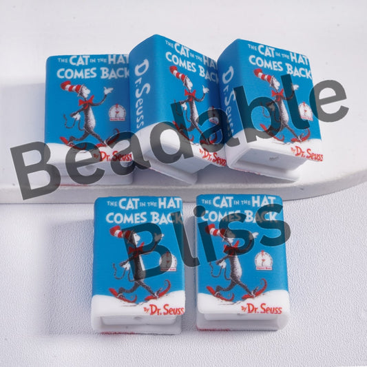 Multiple copies of 'The Cat in the Hat Comes Back' book by Dr. Seuss on a white background.