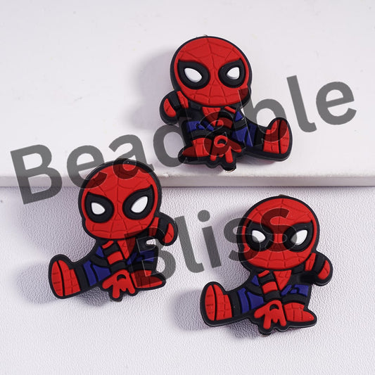 Three red and blue superhero figurines on a white background with 'beadablebliss' text.