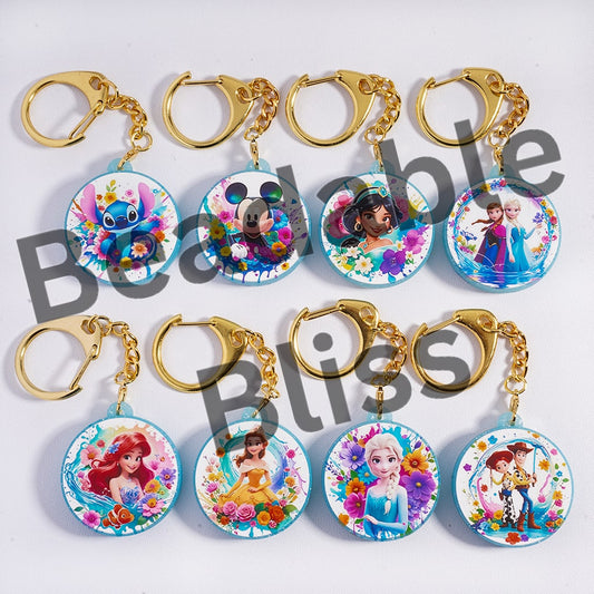 Set of keychains with cartoon character designs on a white background