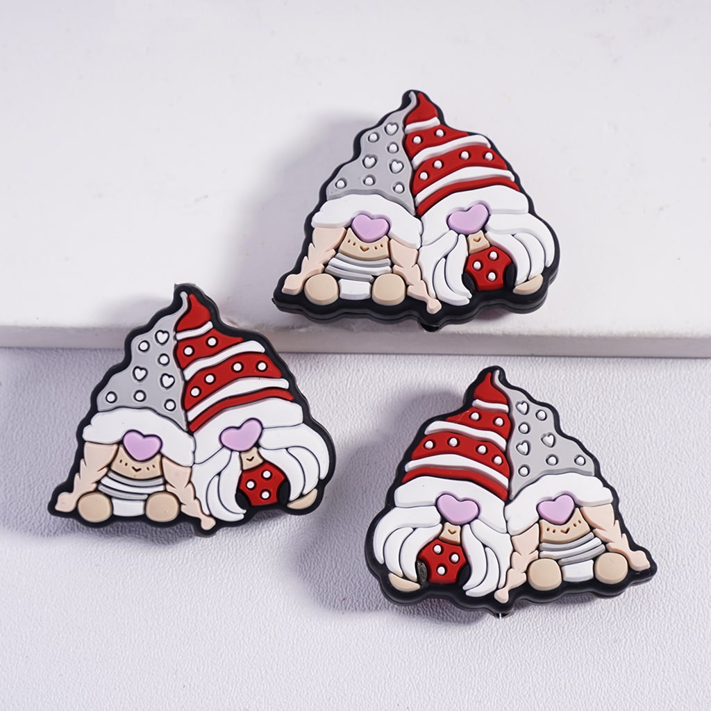 Three cartoon-style gnomes with red and white hats on a light gray background