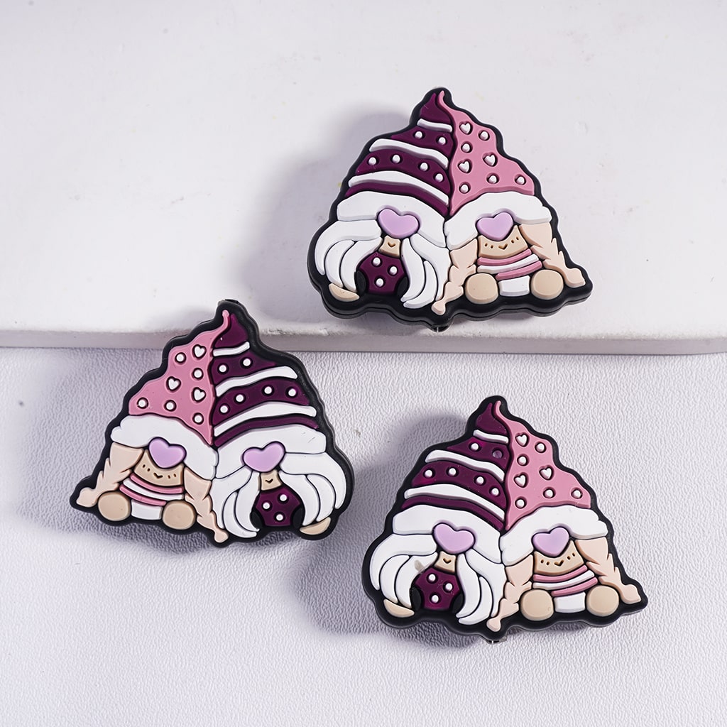 Three cartoon-style gnomes with purple hats and pink hearts on a white background
