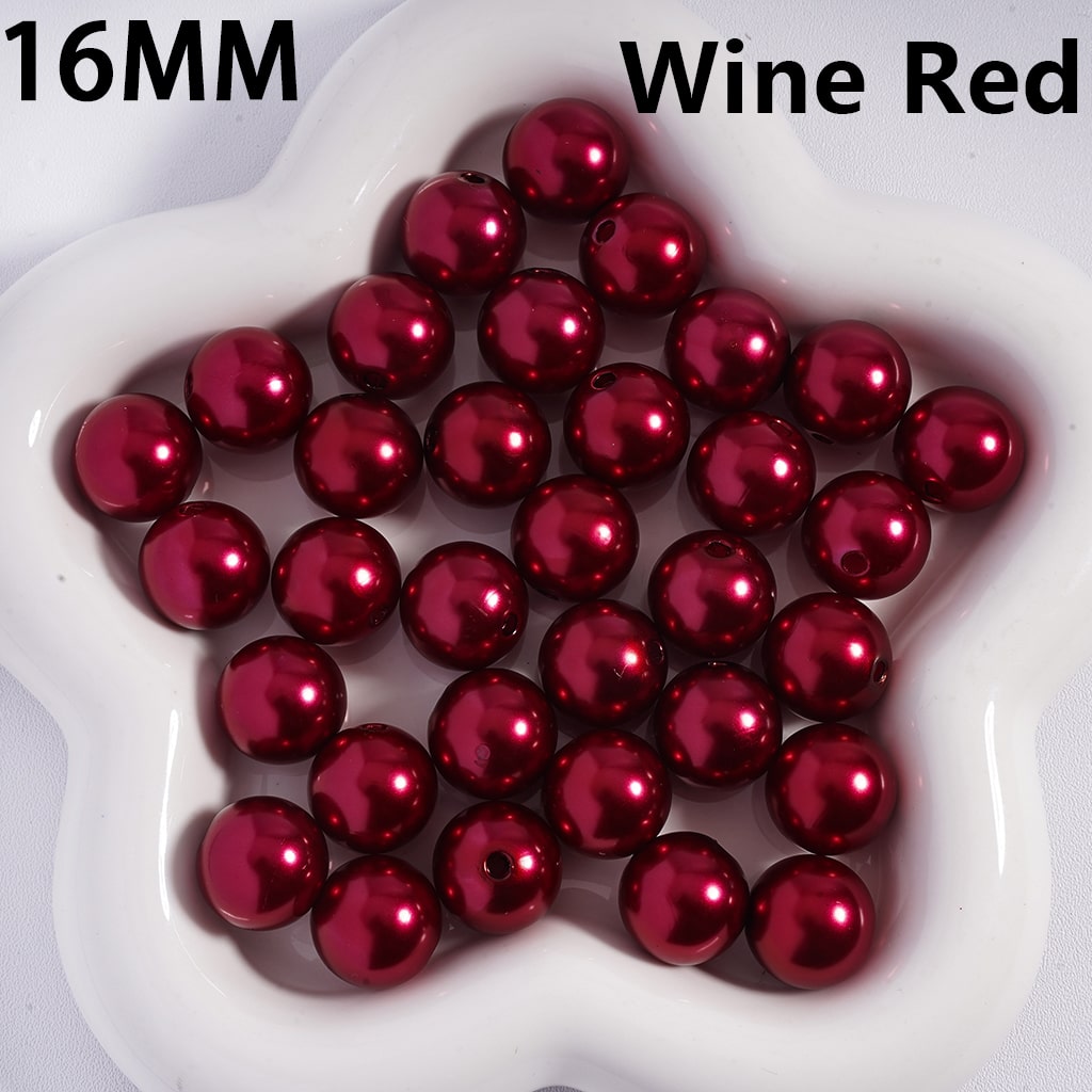 16MM wine red beads on a white dish