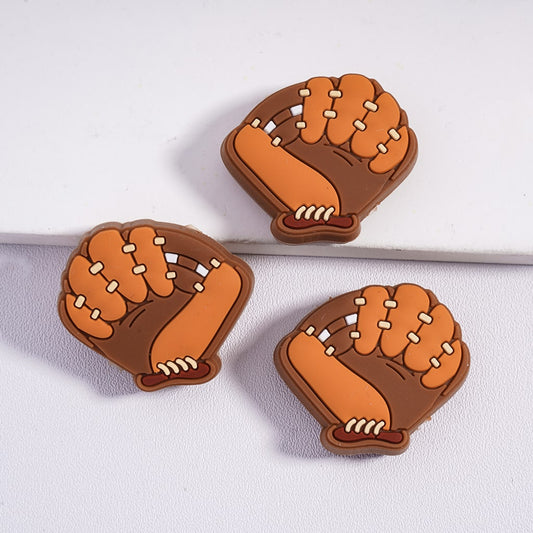 Three brown and orange baseball gloves on a white background