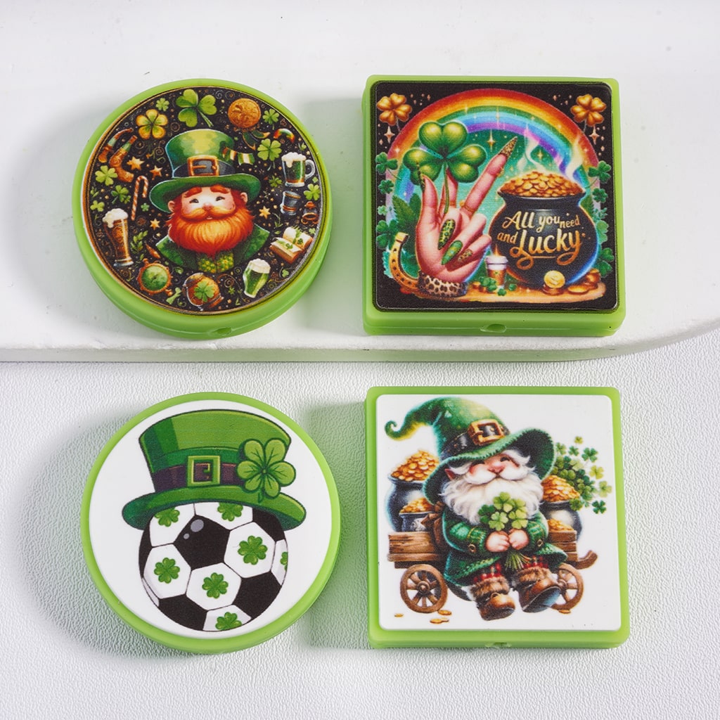 Set of four St. Patrick's Day-themed coasters on a white surface