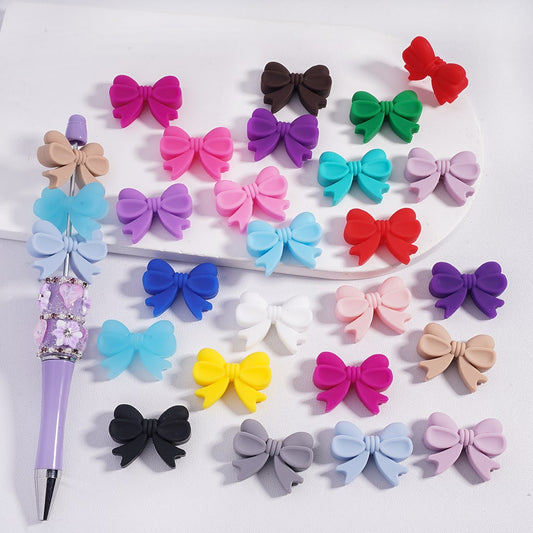 Colorful bow-shaped hair accessories on a white background