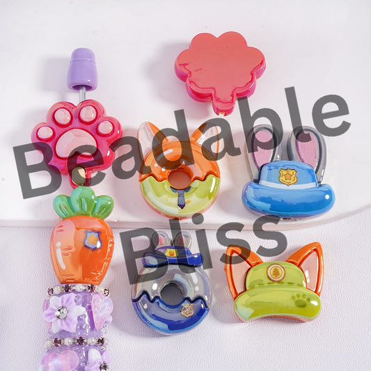 Colorful dog toys with animal designs on a white background