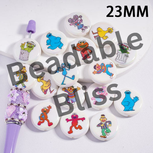 Set of Sesame Street-themed buttons with colorful characters on a white background.