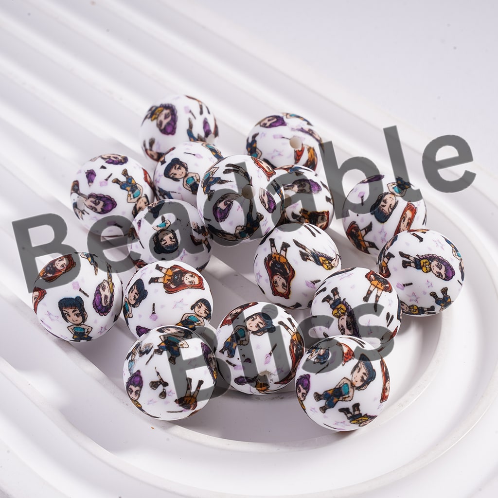 Decorative knobs with character designs on a white surface
