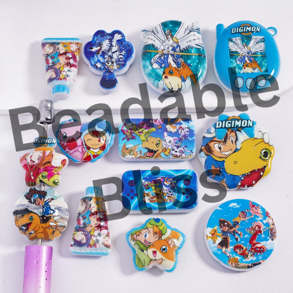 Collection of colorful Digimon-themed toys and accessories on a white background.