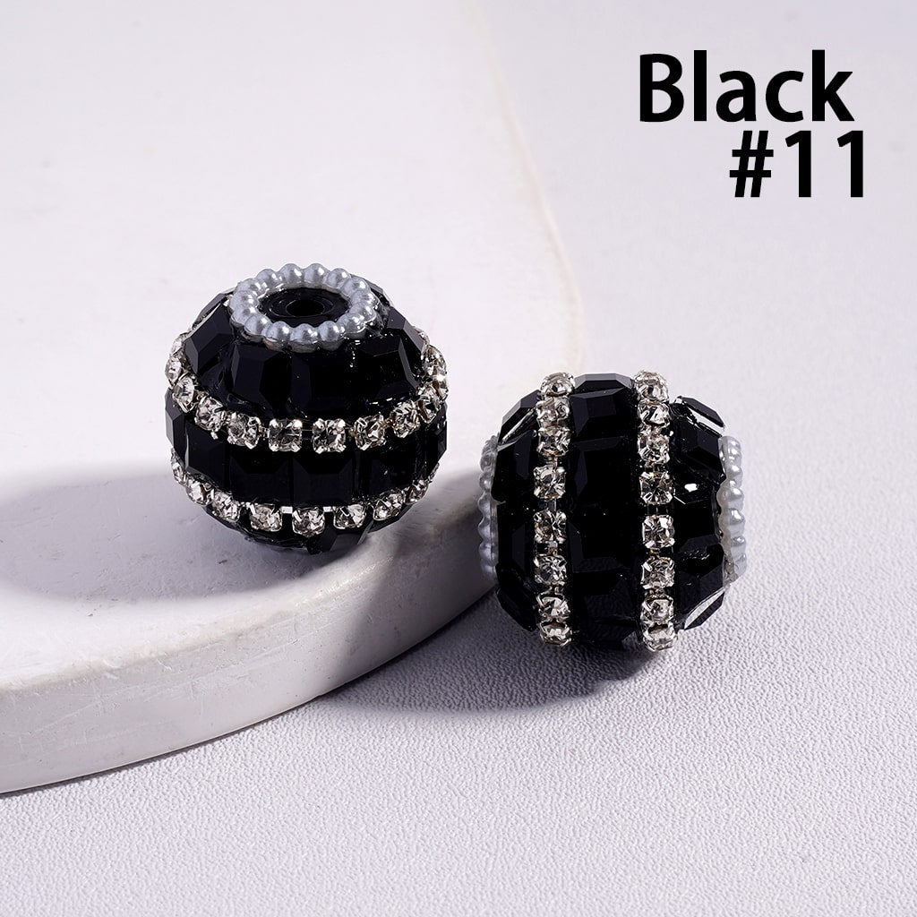 Black beaded earrings with clear stones on a white surface, labeled 'Black #11'.