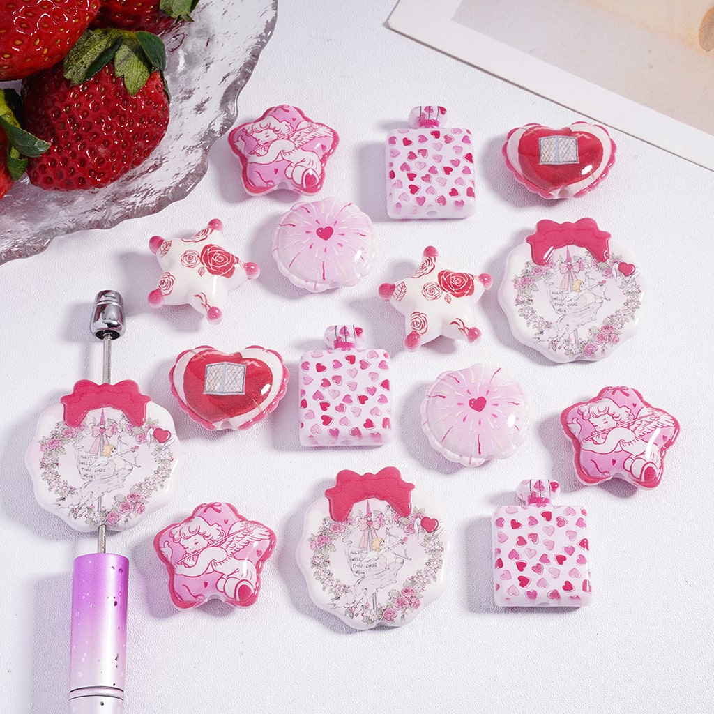 Collection of pink and white stationery items on a light background