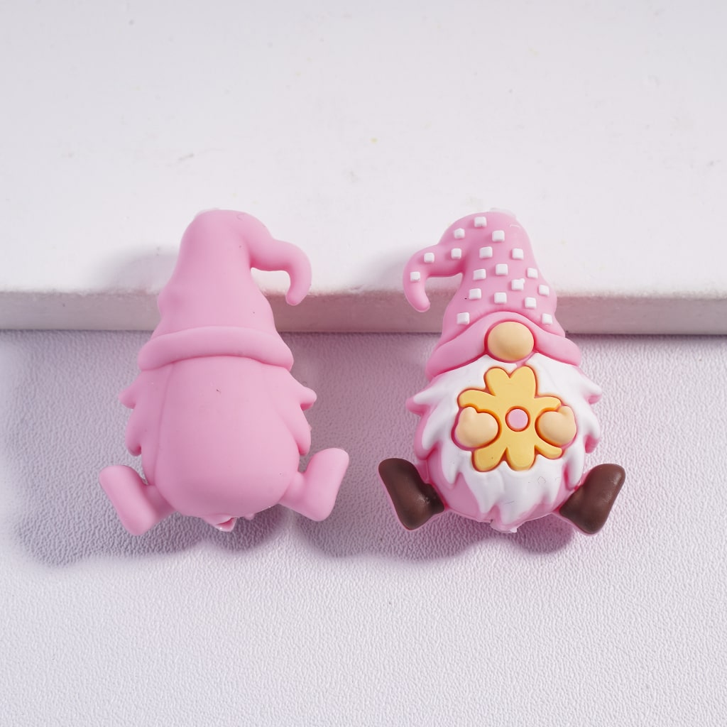 Two pink gnome-shaped clips on a white background