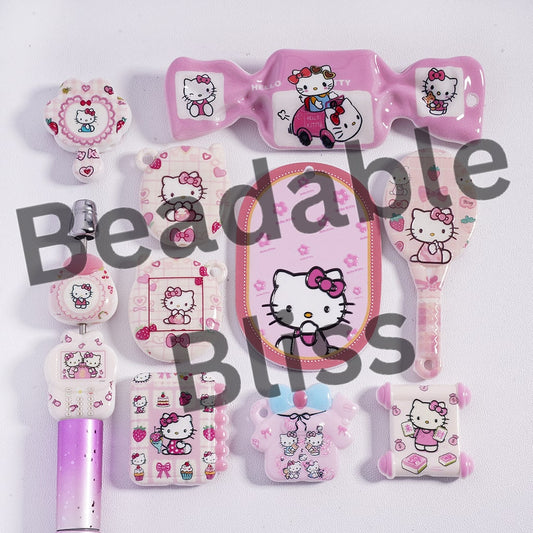 Collection of Hello Kitty-themed stationery items on a white background