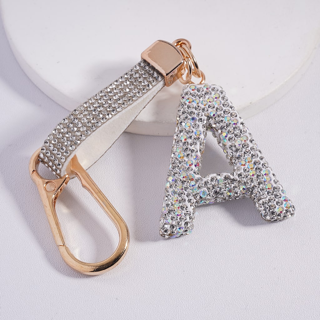 Keychain with letter 'A' and gold carabiner on a white background