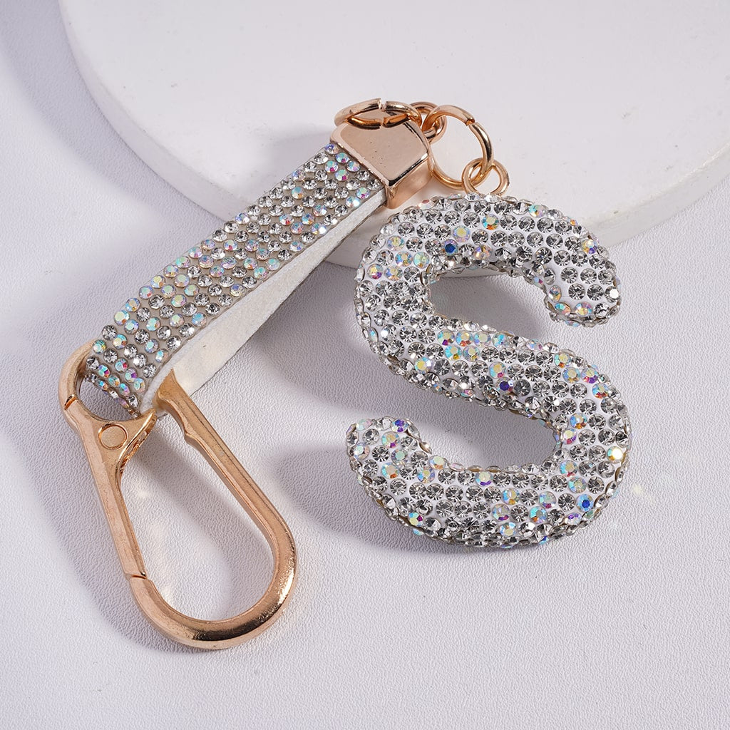 Keychain with letter 'S' made of rhinestones on a white background