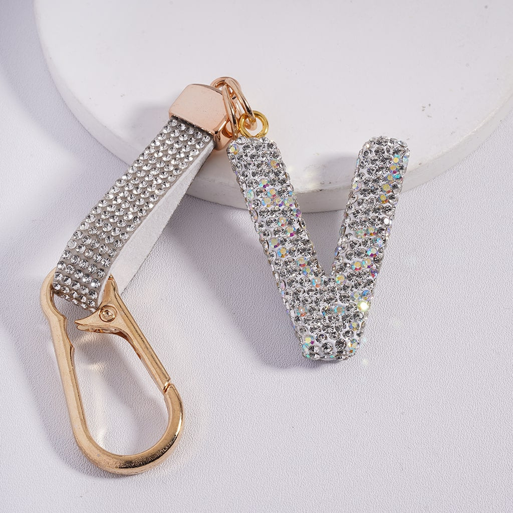 Keychain with rhinestone embellishments on a light gray background