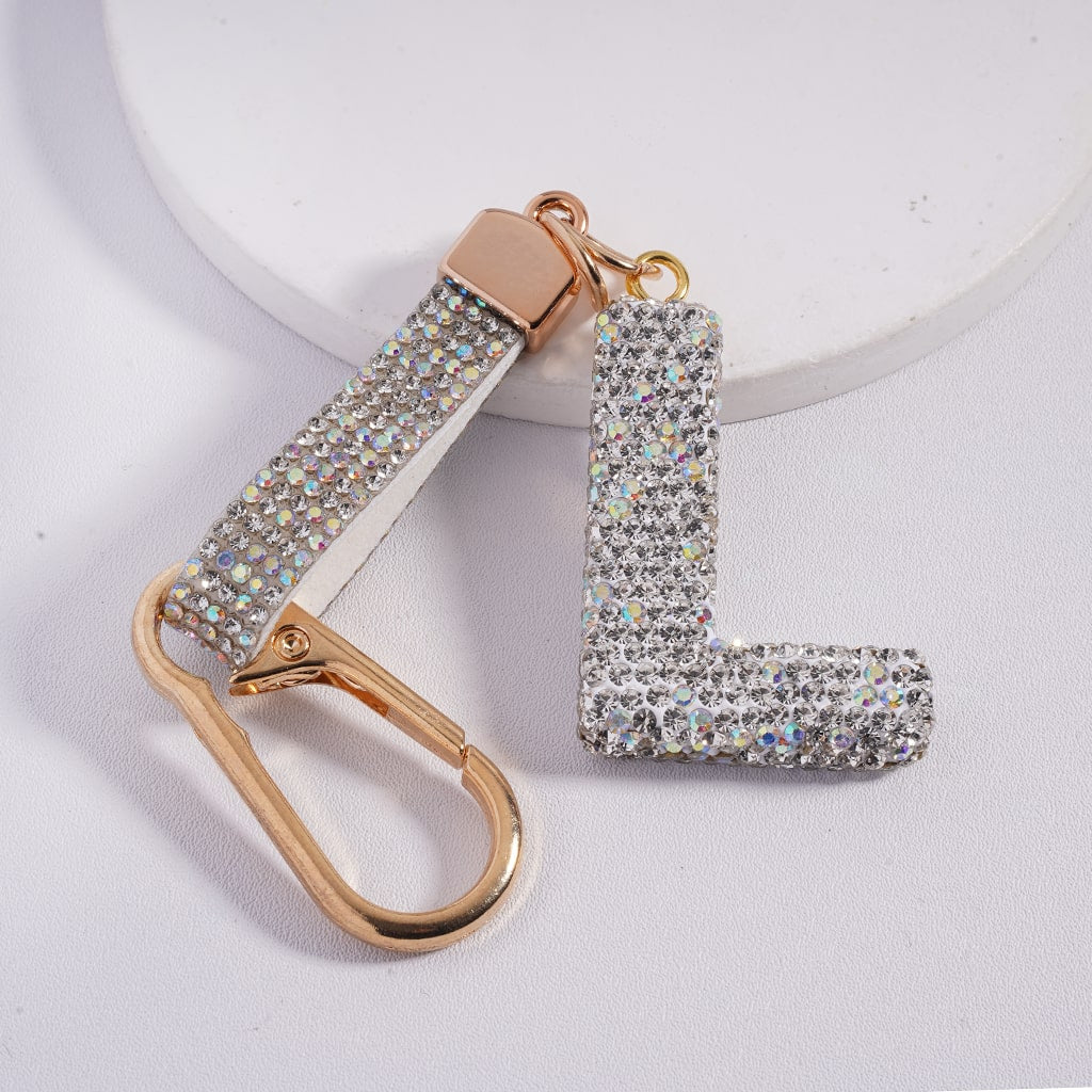 Keychain with letter 'L' design on a light gray background