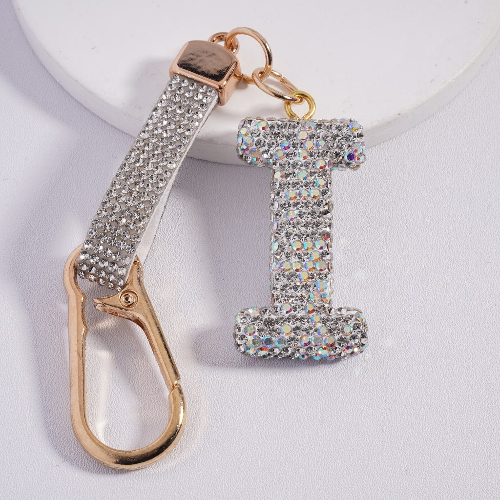 Keychain with rhinestone letter 'I' and gold carabiner on a white background