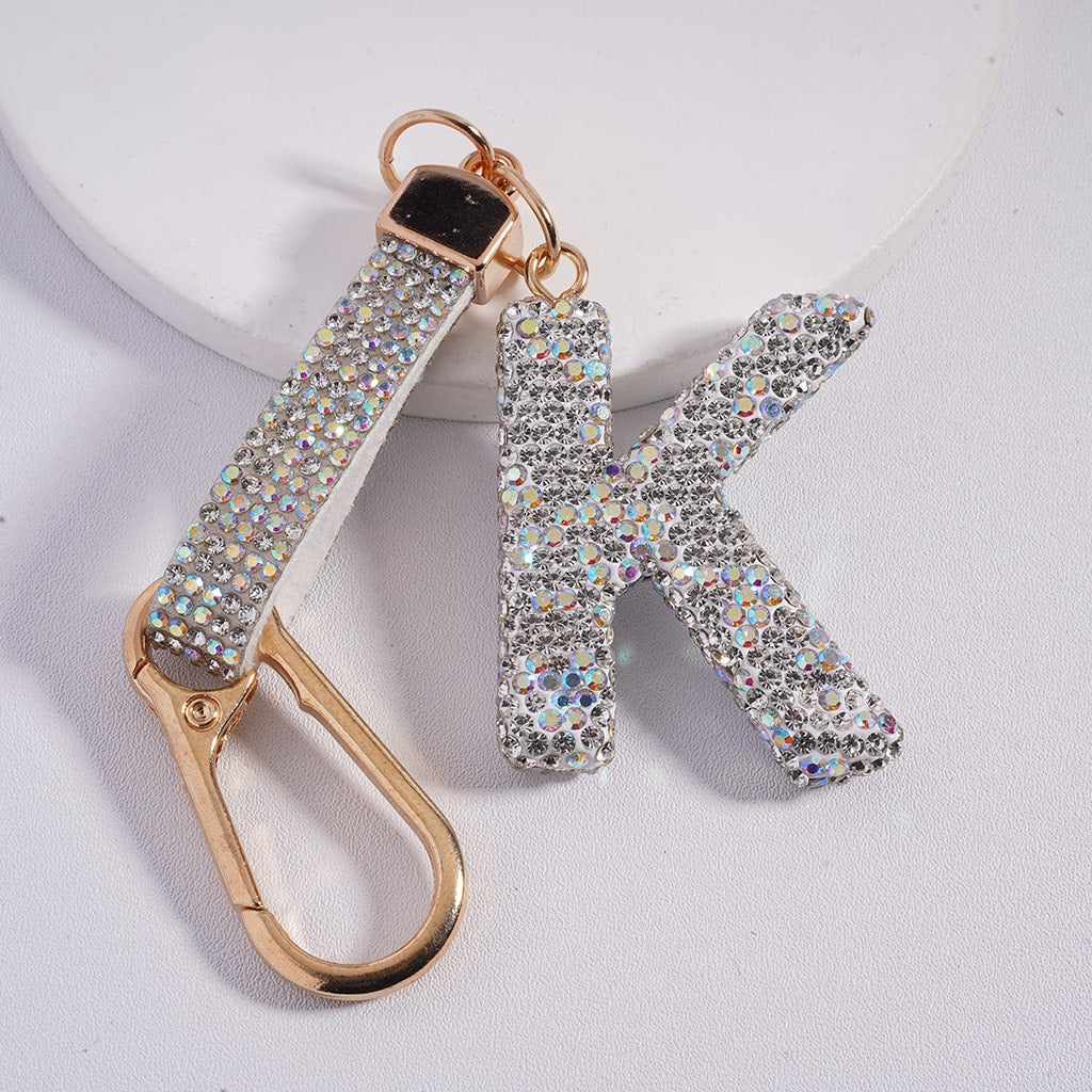Keychain with 'K' letter and gold carabiner on a white background