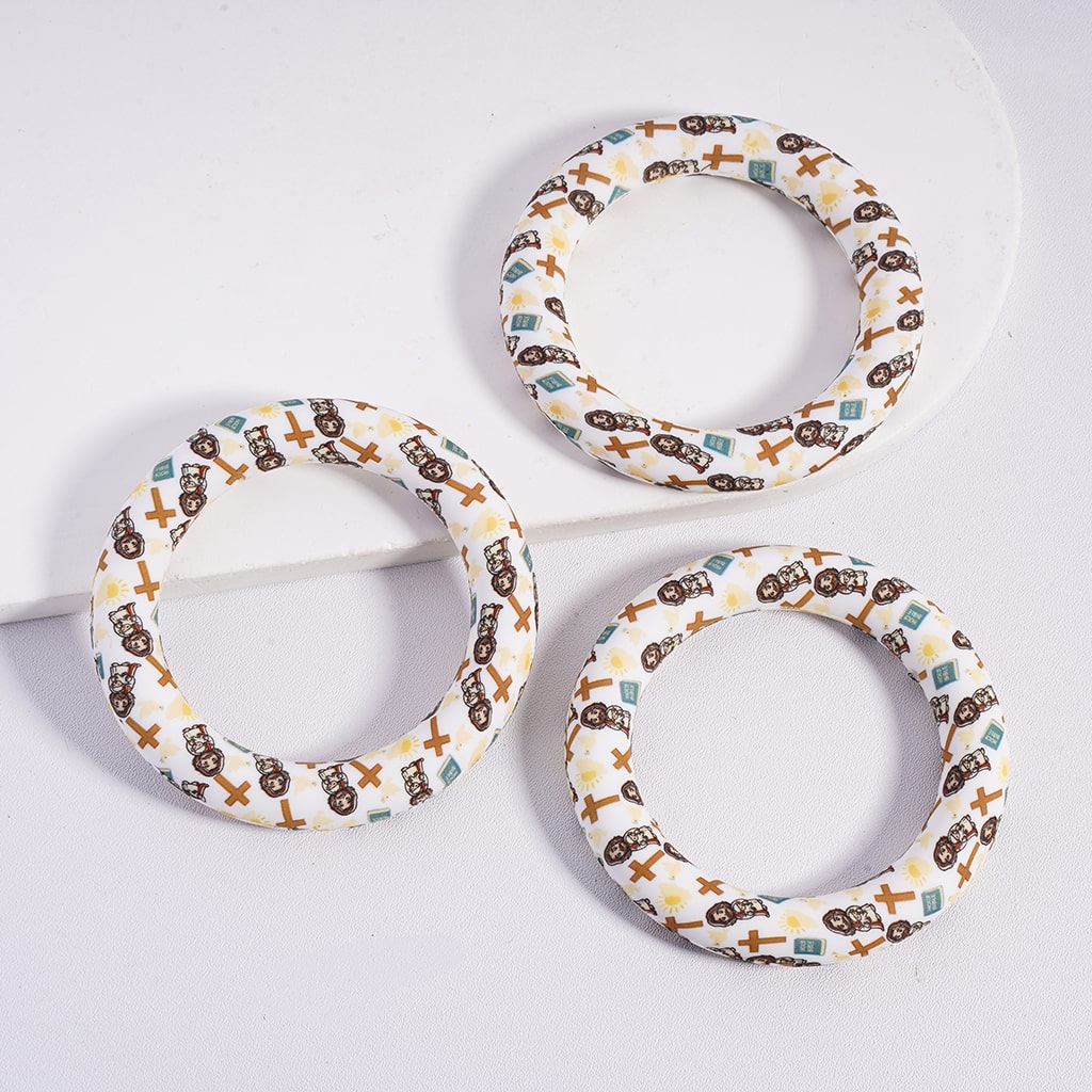 Three circular dog toys with patterned designs on a white background