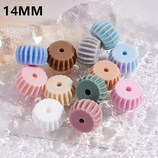 Pastel-colored plastic gears on a textured white background with '14MM' text.