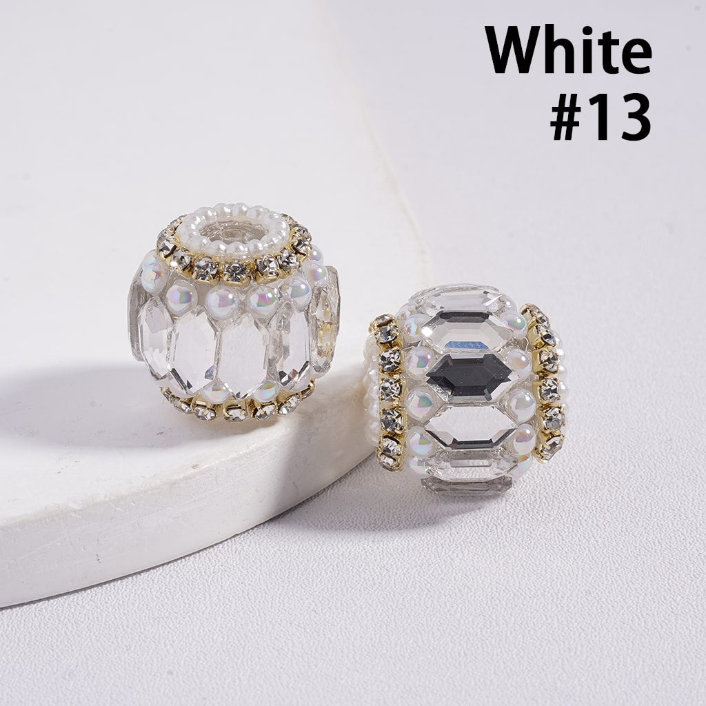 Two crystal beads with gold accents on a white background, labeled 'White #13'.