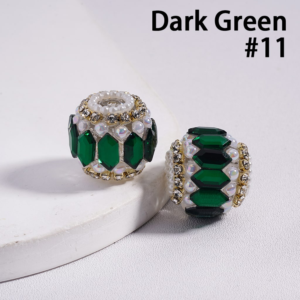 Two dark green beads with gold accents on a white background, labeled 'Dark Green #11'.