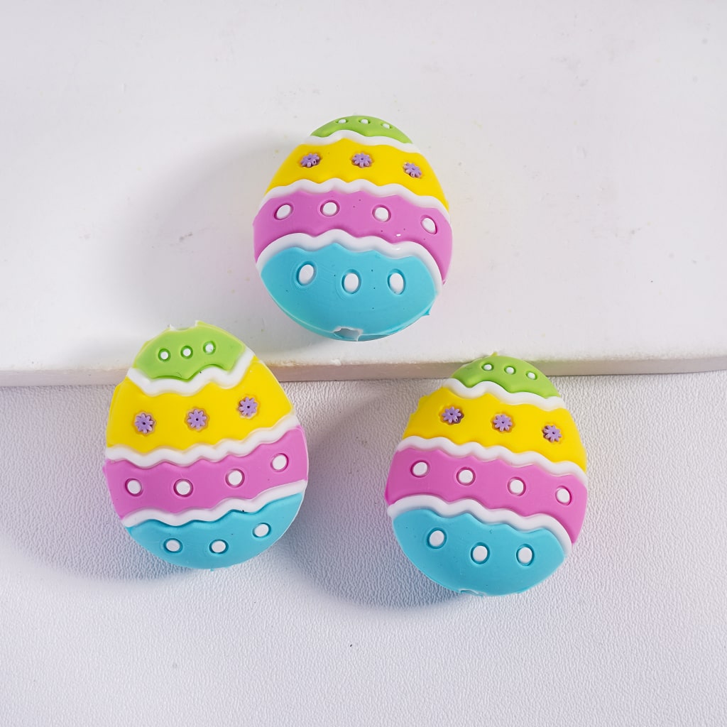 Colorful Easter egg-shaped buttons on a white background