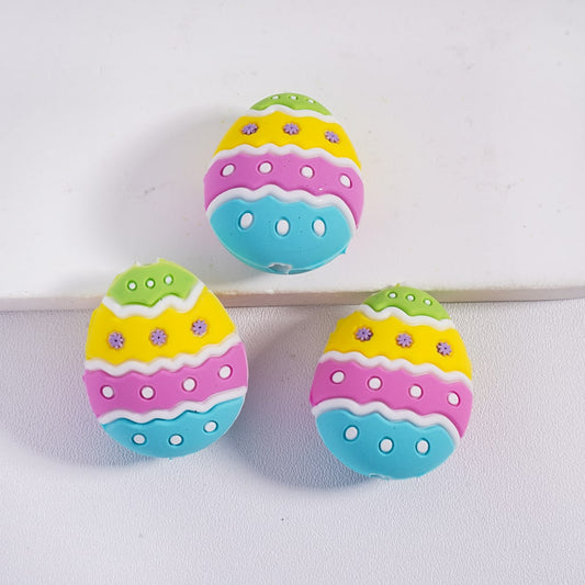 Colorful Easter egg-shaped buttons on a white background