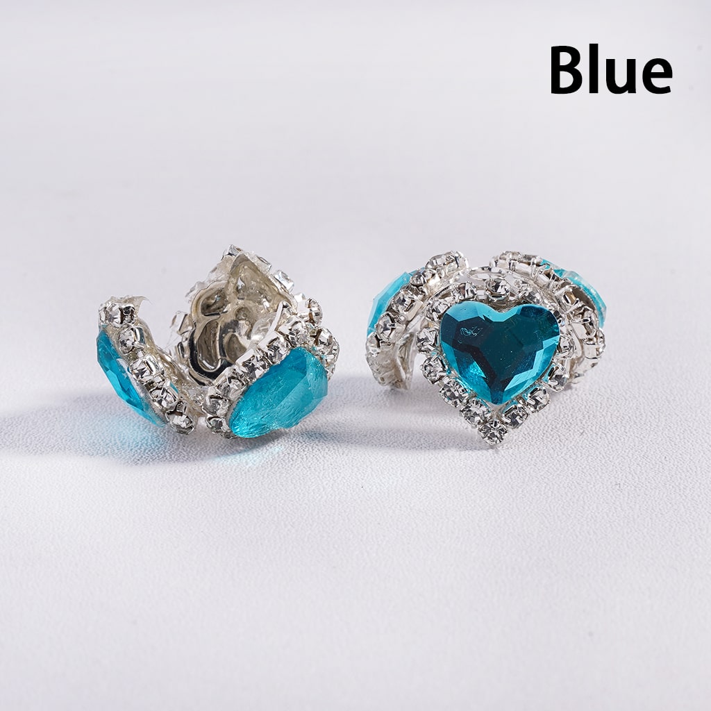 Heart-shaped blue earrings with silver accents on a white background