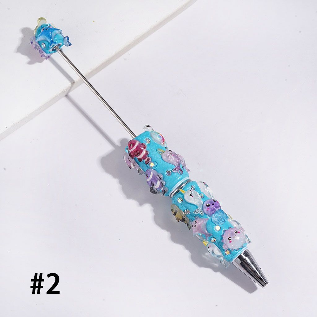 Beadable Clay Pens Fish Sea Turtles Jellyfish Shrimp Dinosaurs and AB Rhinestones, White and Turquoise Background