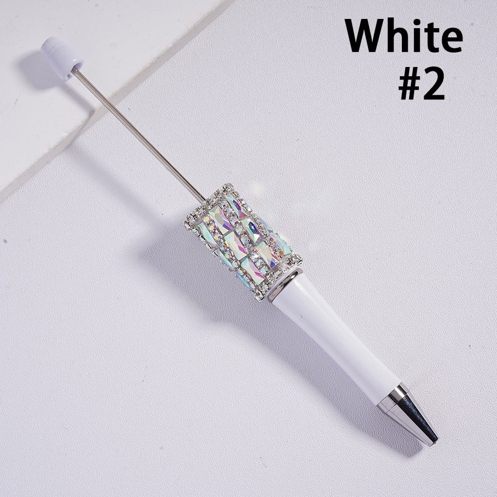 White pen with decorative cap on a light gray background