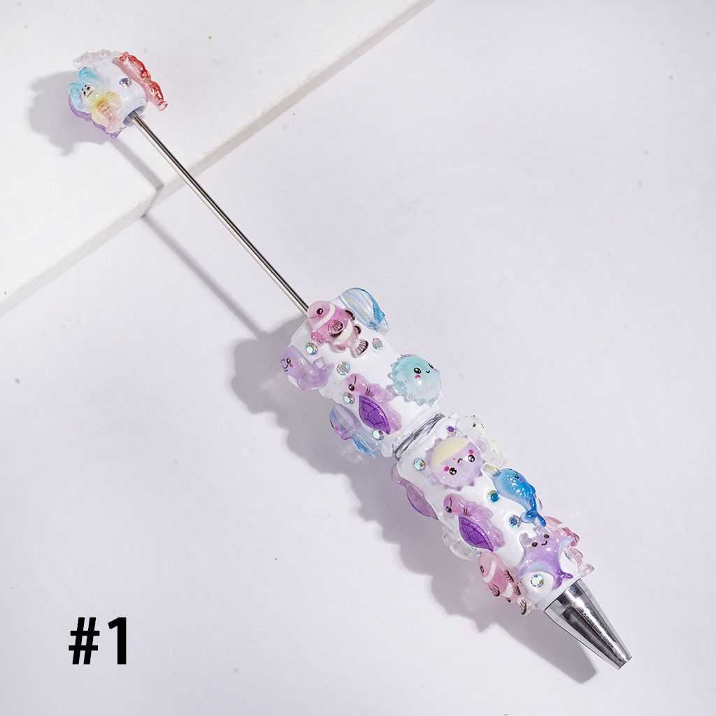 Beadable Clay Pens Fish Sea Turtles Jellyfish Shrimp Dinosaurs and AB Rhinestones, White and Turquoise Background